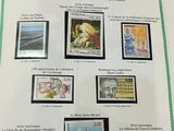 a picture of a collection of stamps on a table