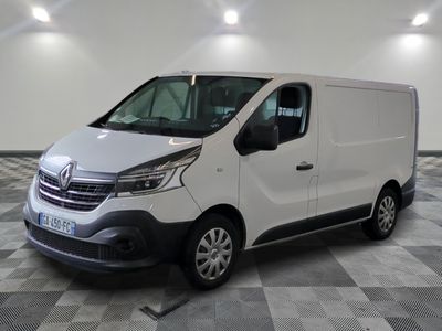 the white van is parked on a checkered floor in a room