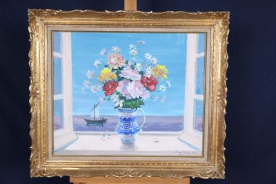 une peinture de fleurs dans un vase sur un chevalet