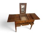 a small wooden table with a mirror on top of it