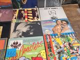 a lot of records on a table in a room