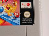 an old nintendo game is shown on a white surface