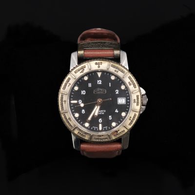 an image of a close up of a watch on a black background