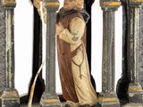 figurine of a monk holding a staff in a stone arch
