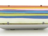 brightly colored wooden box on white surface with metal studs