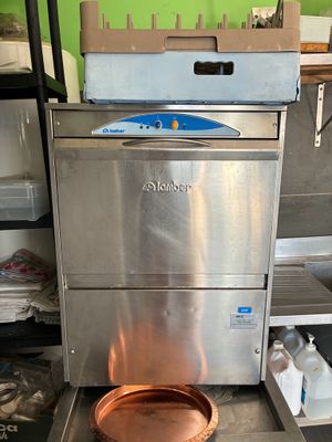 an image of a kitchen with a copper pot on the stove