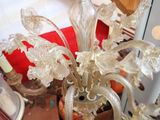 a glass chandelier that is sitting on a table