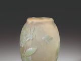 a glass vase that is sitting on a table