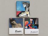 three paintings of a woman and a man on a wall