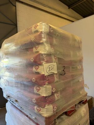 a large stack of toilet paper wrapped in plastic