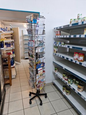 many shelves in the store that have various items on them
