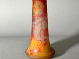 a vase with a design on it sitting on a table