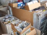 many boxes of assorted items sitting in a room