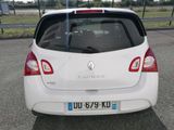 a white car parked on the side of the road