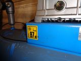 a close up of a blue box with a camera on top of it