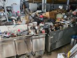 a lot of clutter in the kitchen area of the building