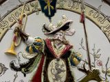 a clock with a picture of a man holding a trumpet