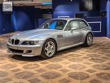 an image of a silver bmw sports car in a showroom