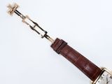 an image of a wrist watch with a brown leather strap