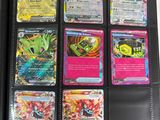 pokemon trading cards in a black wallet on a table