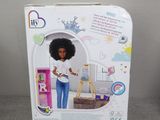 barbie doll in box with black hair and blue jeans
