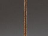 statue of a bird perched on a branch on a black base