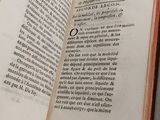 an open book on a table that has a picture of a bird on it
