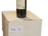 a bottle of wine sitting on top of two boxes