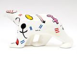 white ceramic polar bear figurine with colorful designs on it ' s body