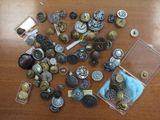 many different types of buttons on a table