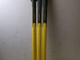 two baseball bats sitting on top of a table next to a wall