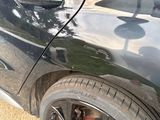 a close up of a car ' s tire with a sticker on it