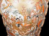 a large vase that has a painting on it
