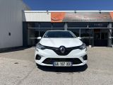 the front of a white car parked in front of a building