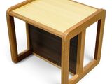 an image of a wooden side table with a magazine holder