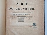 an open book with a black and white title on it