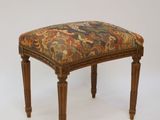 an image of a foot stool with a floral upholstered seat