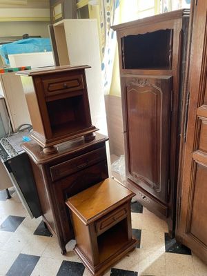 several pieces of furniture are stacked on top of each other on a checkered floor