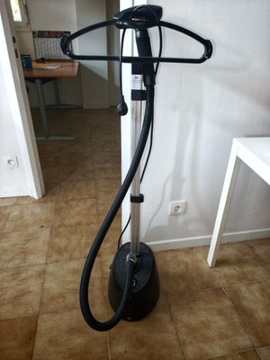 an image of a hair dryer on a stand in a room