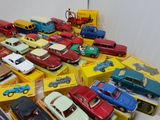 a lot of toy cars that are sitting on a table