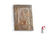 a wooden plaque with a picture of a woman on it
