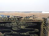 a picture of a black and gold picture on the wall