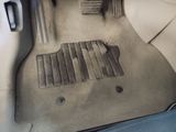 a car that has a dirty floor mat in it