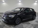 the black car is parked on a checkered floor in the garage