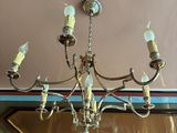 a chandelier hanging from the ceiling in a room