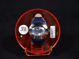 a watch in a red case with a price tag on it