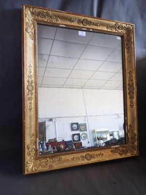 a mirror that is sitting on a black surface