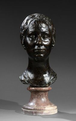 a bronze bust of a young boy on a pedestal