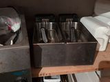 a shelf that has a bunch of pots and pans on it