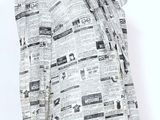 une image d'un mannequin portant une chemise imprimée dans un journal